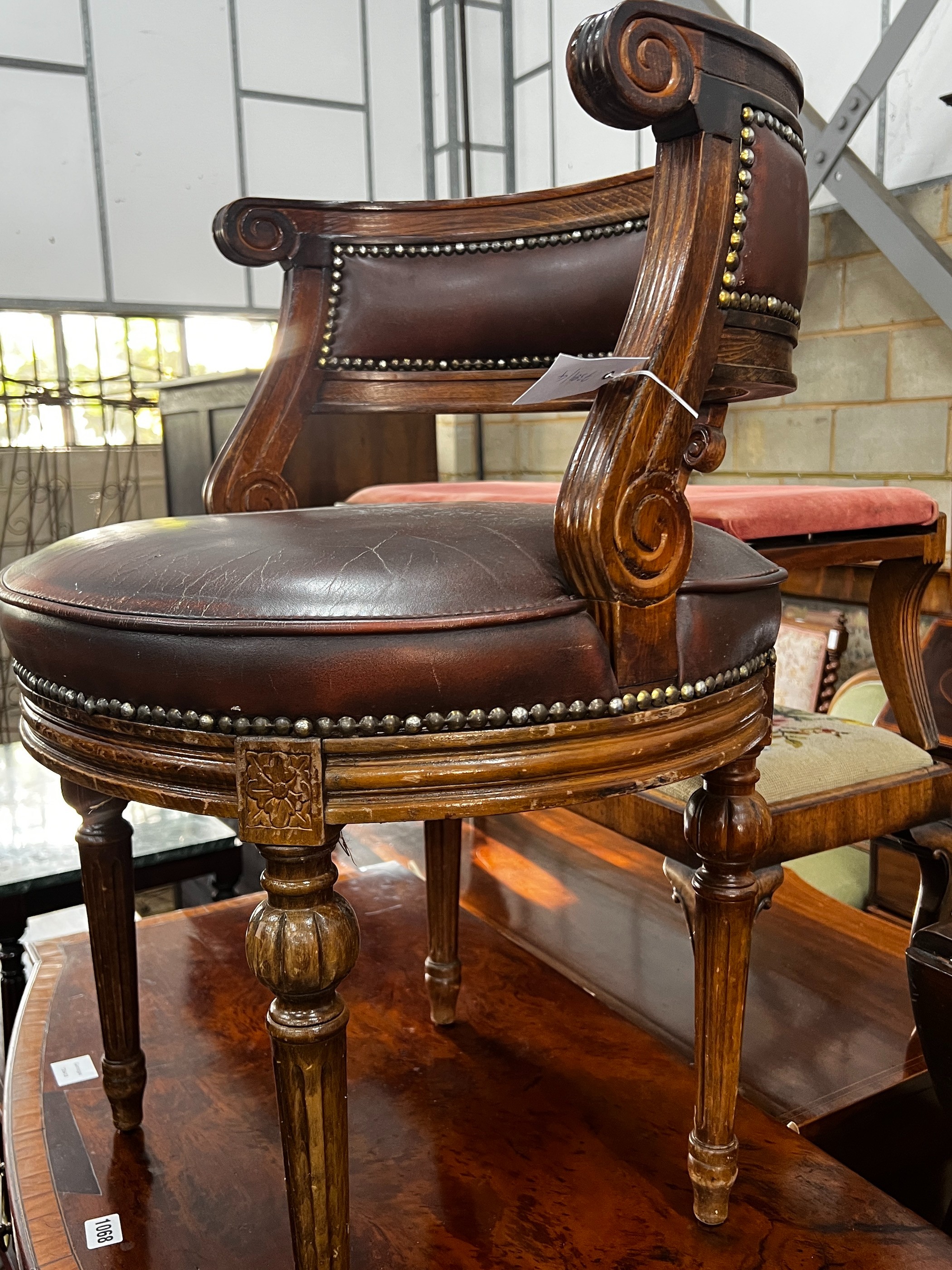 A Continental beech desk chair with leather seat, width 53cm, depth 48cm, height 73cm